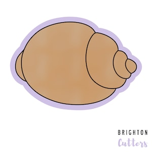 May include: A brown seashell cookie cutter with a purple outline. Brighton Cutters is printed in purple below the cutter.