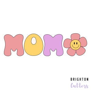 May include: A set of cookie cutters in the shape of the word "MOM" with a yellow circle in the middle and a pink flower with a smiley face in the center. The cookie cutters are pink, yellow, and purple.