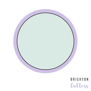 May include: A light purple circle with a black outline and a light blue center. The text "BRIGHTON Cutters" is written in purple below the circle.