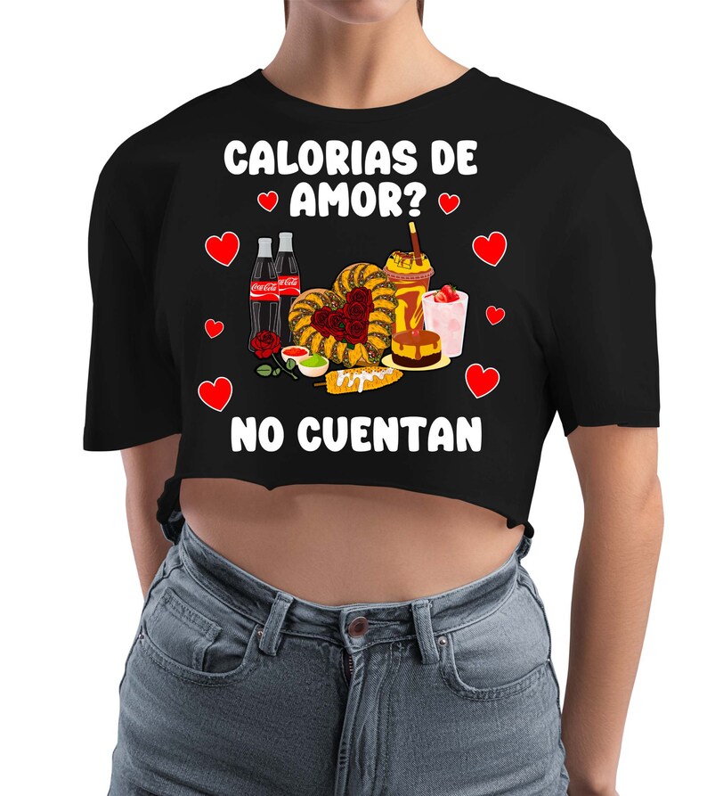 May include: Black cropped t-shirt with white text that reads "Calorias de Amor? No Cuentan" and a graphic of Mexican food and drinks with hearts.