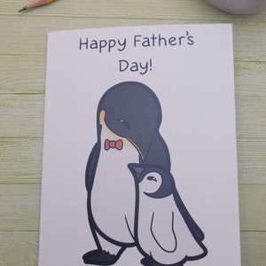 Jolie carte pour la fête des pères avec un manchot empereur
