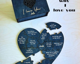 May include: A wooden heart-shaped puzzle with 12 reasons why someone might love another person. The puzzle pieces are engraved with phrases like "You are always by my side" and "You're the calm in the storm". The puzzle is in a wooden box with the words "12 Reasons I Love You Josh" engraved on the top.
