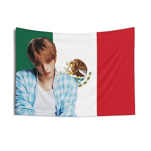 May include: A rectangular wall tapestry featuring the Mexican flag design with a portrait of a person in the center. The flag has green, white, and red vertical stripes, with the Mexican coat of arms in the white stripe.