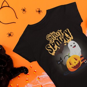 Enchanted Halloween Delight , Unique and Magical Tee , Halloween Tee , Enchanted & Fun Shirt for All Ages , Your Perfect Spooky Style.Unisex