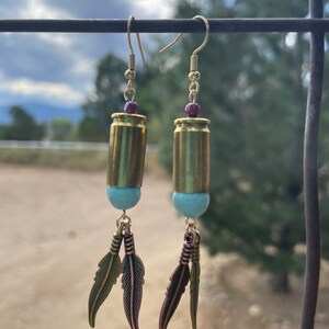 9mm bullet ammo shell gold brass dangle earrings with feathers and beads. Cowgirl 2A western earrings