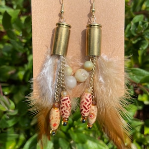 9mm bullet ammo shell gold brass dangle earrings with feathers and wood beads. Cowgirl 2A western earrings