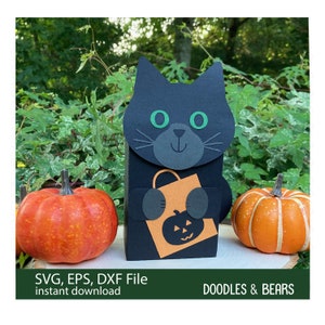 Halloween Black Cat Favor Treat Box - Cute black cat with green eyes holding an orange bag with jack-o-lantern for trick-or-treating is also a box for holding treats or favors. Digital download SVG file for use with Cricut or Silhouette machines.