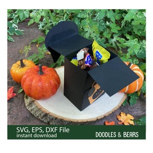 Halloween Black Cat Favor Treat Box - Cute black cat with green eyes holding an orange bag with jack-o-lantern for trick-or-treating is also a box for holding treats or favors. Digital download SVG file for use with Cricut or Silhouette machines.