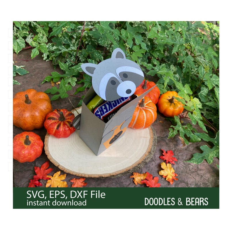 Halloween Raccoon Favor Treat Box - This Favor Treat Box has a cute gray raccoon with gray and white mask holding an orange bag with jack-o-lantern for trick-or-treating. Digital download SVG cut file for use with Cricut or Silhouette machines.
