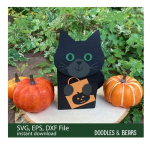 Halloween Black Cat Favor Treat Box - Cute black cat with green eyes holding an orange bag with jack-o-lantern for trick-or-treating is also a box for holding treats or favors. Digital download SVG file for use with Cricut or Silhouette machines.