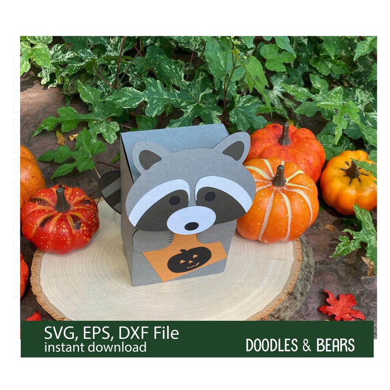 Halloween Raccoon Favor Treat Box - This Favor Treat Box has a cute gray raccoon with gray and white mask holding an orange bag with jack-o-lantern for trick-or-treating. Digital download SVG cut file for use with Cricut or Silhouette machines.