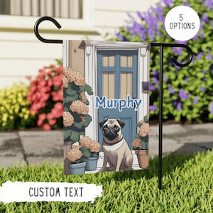 May include: A garden flag with a cartoon pug dog sitting in front of a blue door. The flag has the text "Murphy" on the door and flowers on either side of the dog.