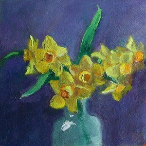 May include: A bunch of yellow daffodils in a green vase against a purple background.