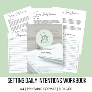 May include: A workbook titled "Setting Daily Intentions" with a light blue cover and a silver pen. The workbook is a guide to bring focus and awareness to your day. The text "A Workbook to Bring Focus and Awareness to Your Day" is printed on the cover. The workbook is printed on 8 pages and is in A4 format.