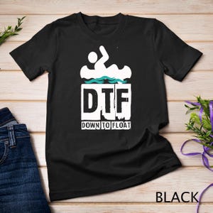 May include: Black t-shirt with a white graphic of a person in a canoe with the text "DTF" and "Down to Float" underneath.
