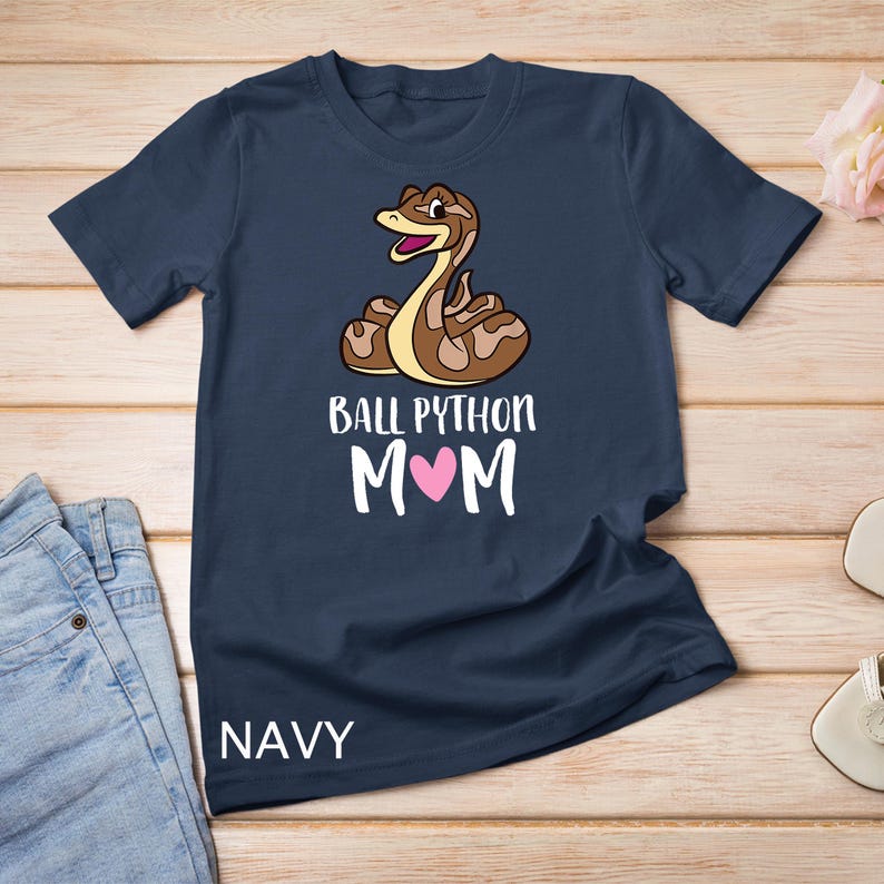 May include: A navy blue t-shirt with a cartoon ball python and the text "Ball Python Mom" with a pink heart.