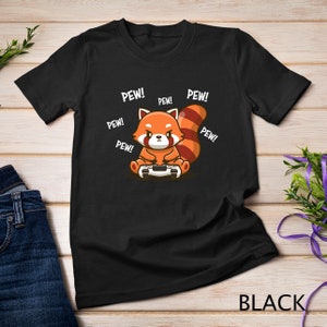 May include: Black t-shirt with a cartoon red panda holding a video game controller. The text "PEW!" is repeated around the panda.