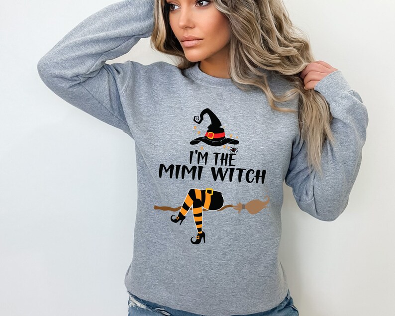 May include: Gray sweatshirt with a witch graphic and the text "I'm the Mimi Witch".