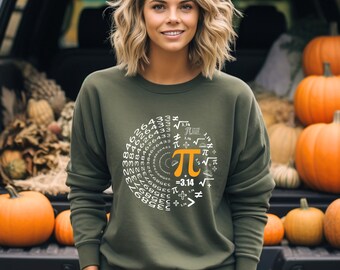 May include: An olive green sweatshirt with a Pi symbol design in white and orange. The design incorporates mathematical symbols and the number 3.14. The sweatshirt is a long-sleeved crew neck.