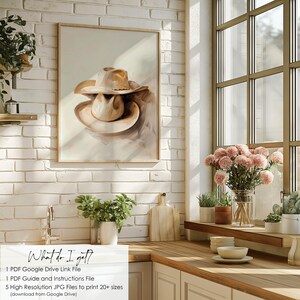 May include: A digital painting of two brown cowboy hats stacked on top of each other. The hats are painted in a watercolor style with soft edges and a light brown background.