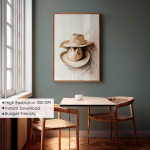 May include: A painting of a beige cowboy hat with a brown band, hanging on a wall in a room with a wooden floor and two chairs.
