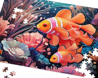 May include: A colorful jigsaw puzzle featuring an underwater scene with orange clownfish, coral, and other marine life. The puzzle is partially assembled, with some pieces scattered around. The artwork has a vibrant, watercolor style.