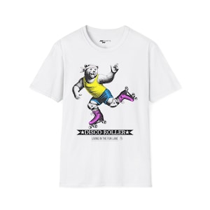 May include: White t-shirt with a graphic of a bear wearing roller skates and a yellow tank top. The text "Disco Roller" and "Living in the Fun Lane" is printed below the graphic.