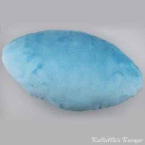 May include: A light blue, cloud-shaped plush pillow. The pillow has a soft, velvety texture and is a solid colour. The pillow is a light blue colour and is a solid shape. The text "Kafluffle's Korner" is in the bottom right corner.