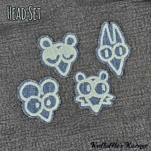 May include: Four embroidered patches featuring stylised cartoon character heads in light blue thread on a dark denim background. The text HEAD SET appears in the top left corner, and the text Kathuffle's Korner is in the bottom right corner.