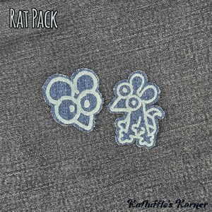 May include: Two denim fabric patches featuring embroidered rat designs with light blue outlines. One patch shows a rat head, the other a full-body rat. The text RAT PACK is at the top left, and Kafluffle's Korner is at the bottom right.