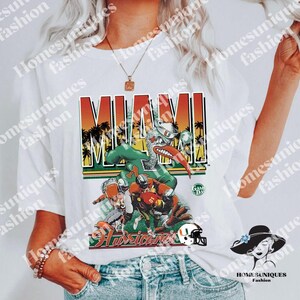 Vintage NCAA Miami Hurricanes Mascot Logo Shirt, Miami Hurricanes Shirt -  Bluefink