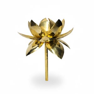 May include: A golden lotus flower sculpture with detailed petals and a stem. The flower is made of a shiny, reflective metal, and the design is a symbol of purity and enlightenment.
