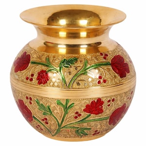 May include: A gold-coloured decorative vase with a wide mouth and a rounded body. The vase is decorated with red floral designs and green foliage, set against an etched background. The overall design is ornate and detailed.
