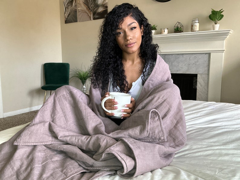 women in linen weighted blanket