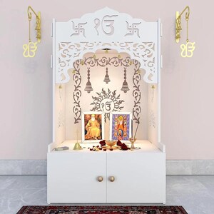 HDHMR board which we use has characteristics include High Density, High Moisture Resistance, Termite Resistance, and a ready-to-use smooth surface.      Large white wooden Hindu mandir with decorative lotus cutouts, bells, diyas and spacious prayer area