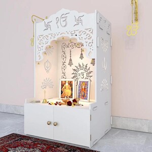 On the lookout for a designer & compact mandir for home. Bring this handcrafted and intricately carved wooden temple to your home right away and make your puja room stand out in terms of decor.