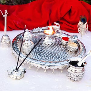 12.5 inches dia antique peacock engraved design Ghungaru thali with flute Krishna Tilak stick in pure German Silver finish for Pooja