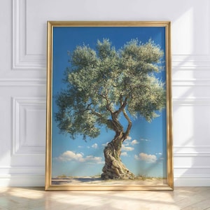 May include: A framed art print depicting a detailed painting of a mature olive tree. The tree has a twisted trunk and lush green foliage, set against a bright blue sky with fluffy white clouds. The frame is gold.