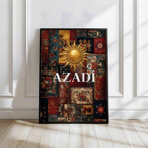 May include: Framed art print featuring a patchwork design with floral patterns in red, blue, and gold. A golden sun emblem is centered above the white text "AZADI". The artwork is encased in a black frame.