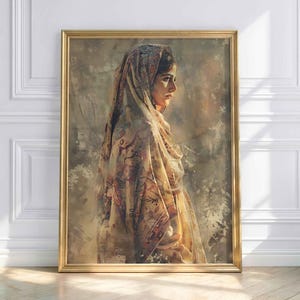 May include: A framed portrait of a woman in profile, wearing a patterned headscarf and shawl. The artwork has a warm color palette with gold and brown tones. The frame is gold.
