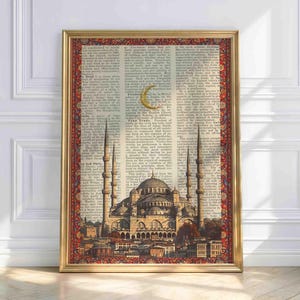 May include: A framed print featuring a detailed illustration of a mosque with tall minarets and a large dome, set against a backdrop of vintage dictionary pages. The print has a gold frame and a decorative border.