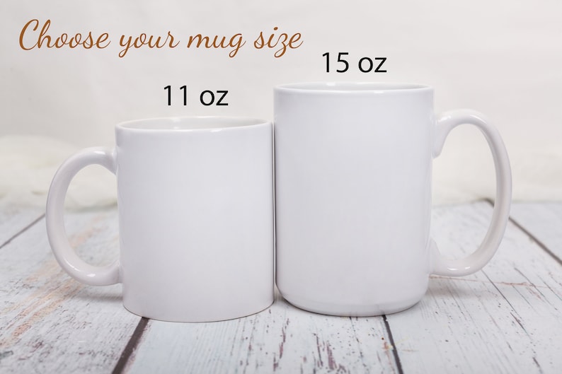 May include: Two white ceramic mugs, one 11 oz and one 15 oz, side by side on a whitewashed wood surface. Choose your mug size.