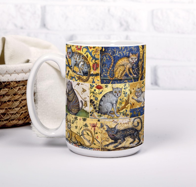 May include: White ceramic mug with a colorful design of cats in a medieval style. The mug has a large handle and is decorated with a repeating pattern of cats in different poses.