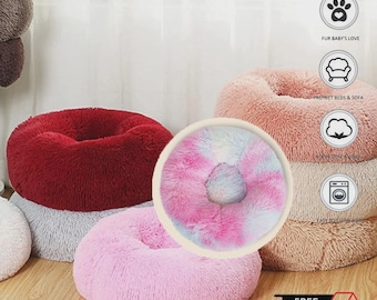 Cama relajante para mascotas con forma de rosquilla.