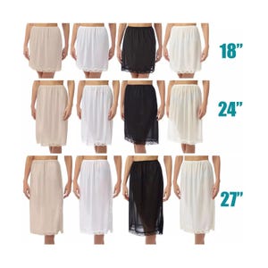 May include: A selection of women's slips in beige, white, and black. The slips are available in lengths of 45.7 cm, 61 cm, and 68.6 cm. Each slip has a lace trim at the hem.