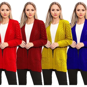 May include: Four open-front cardigans in red, burgundy, yellow, and blue. Each sweater has a textured knit design and two front pockets. The models are wearing black trousers and white shirts underneath the cardigans.