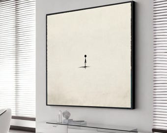 May include: A minimalist art print featuring a solitary figure with a black dot head and a thin body, standing on a small shadow. The artwork is set against a cream-colored background within a black frame, creating a stark contrast.