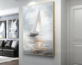 May include: A framed painting of a white sailboat on a calm, gray sea with a light blue sky. The painting has a textured, brushstroke effect and a gold frame.