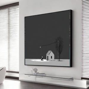 May include: Black and white framed art print depicting a minimalist scene. A small house and a tree stand under a dark sky. A person sits under a street light, creating a stark contrast.