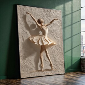 May include: A framed artwork showing a ballerina in a dance pose. The figure is made from a textured, off-white material, with arms extended and a flowing tutu. The artwork is set against a neutral background, creating a striking visual contrast.